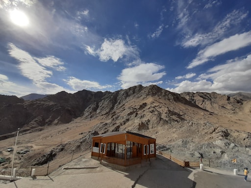 A sleek portable cabin set against a desert backdrop under a clear blue sky.