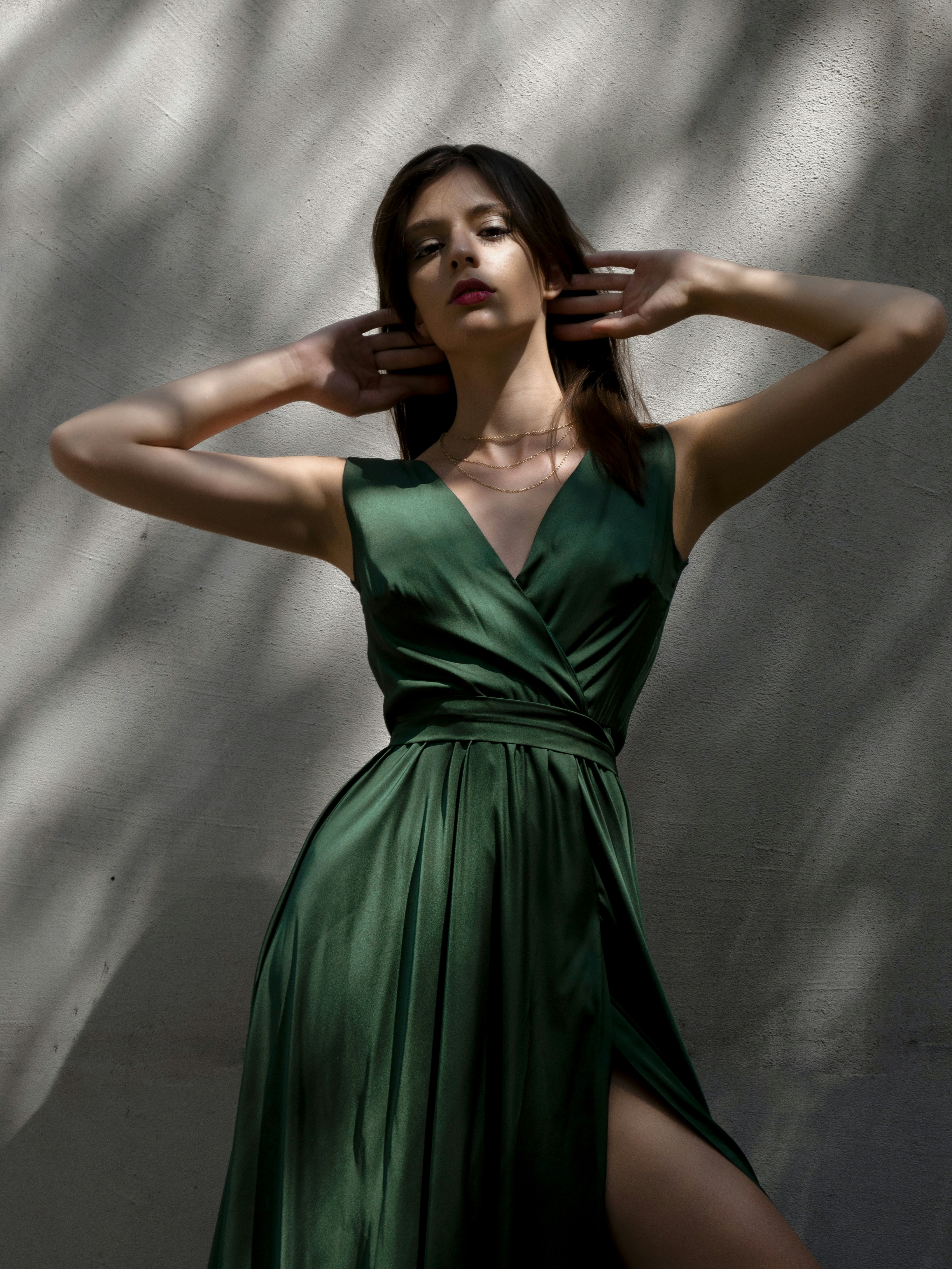 A woman in a green dress posing for a picture photo – Free Girl Image ...