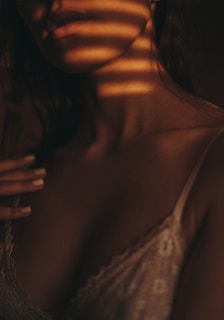 Soft natural light highlighting clothing details on model.