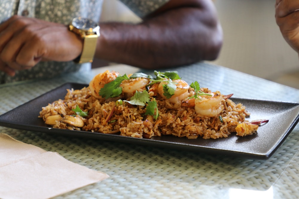 a plate of food with shrimp and rice