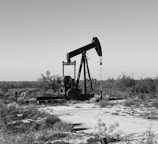 a black and white photo of an oil pump