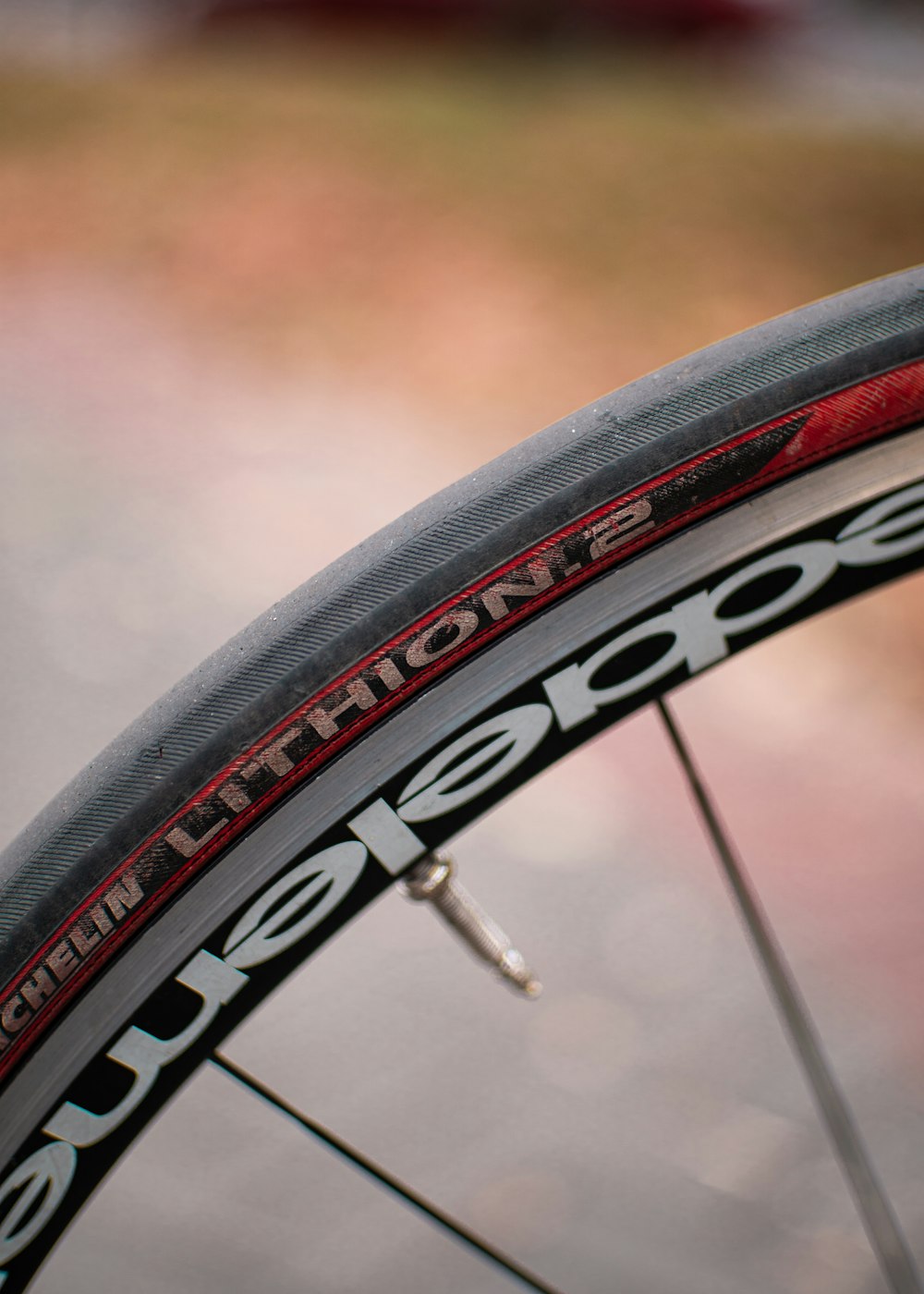 a close up of a bicycle tire on a road