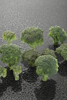 Bright green steamed broccoli florets glistening with a light olive oil drizzle.