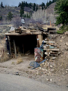 a pile of wood sitting in front of a building