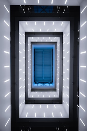 a room with a blue window in the middle of it