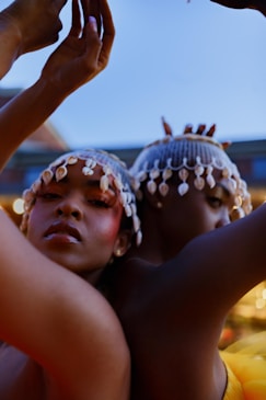 a couple of women standing next to each other