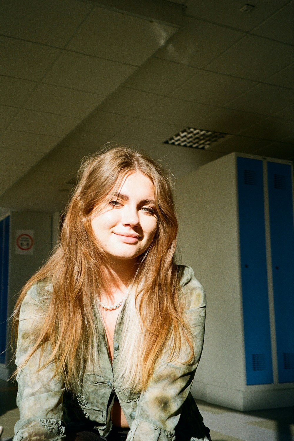 a woman sitting on the floor in a room