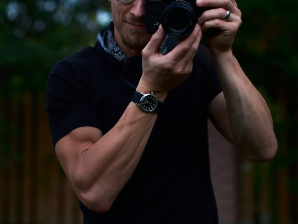 a man taking a picture of himself with a camera