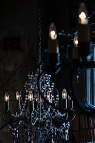 a chandelier hanging from a ceiling in a dark room