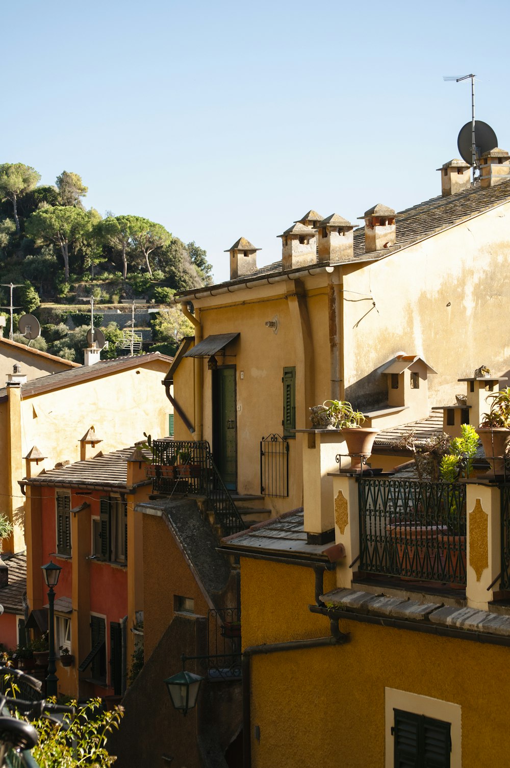 a row of buildings with a clock tower in the background