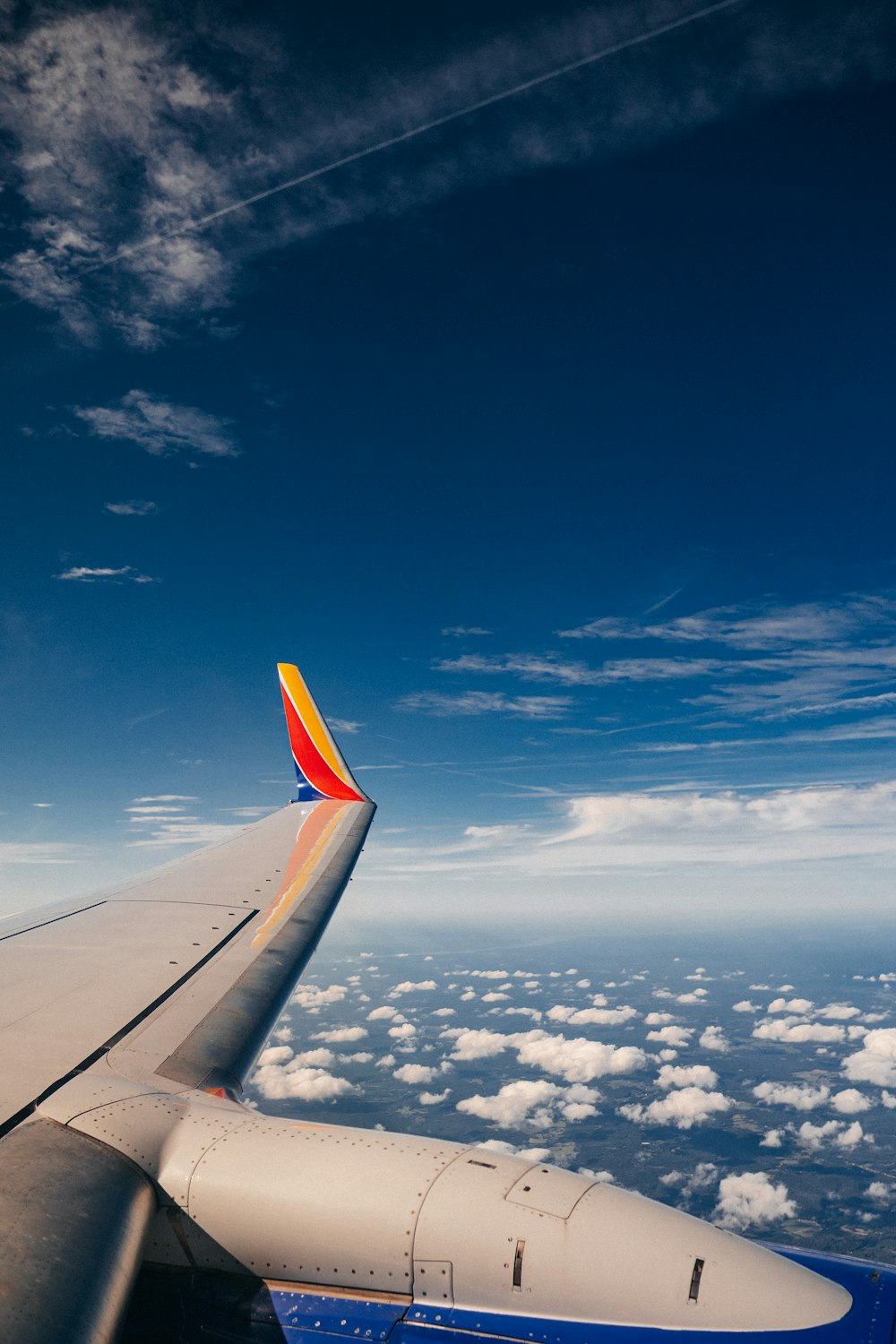 a view of the wing of an airplane in the sky