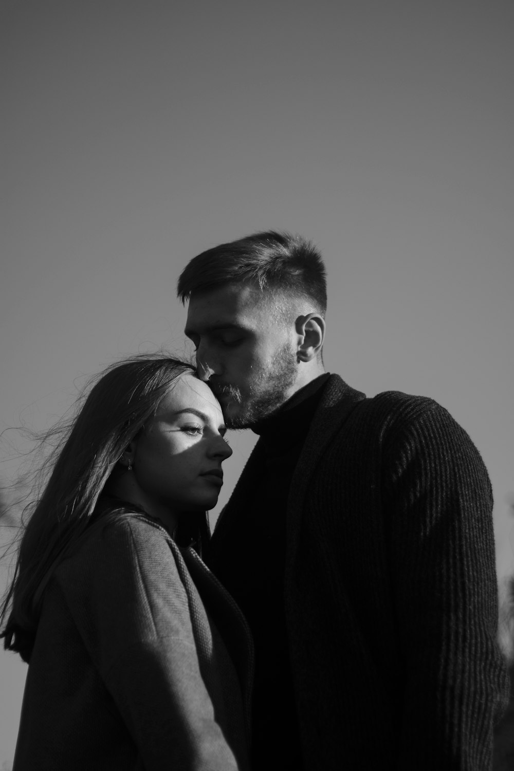 a man and a woman standing next to each other