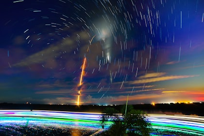 Rocket launch with star trails