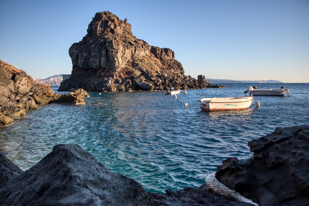 a small boat floating in a body of water