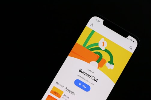 a cell phone with a picture of a plant on the screen