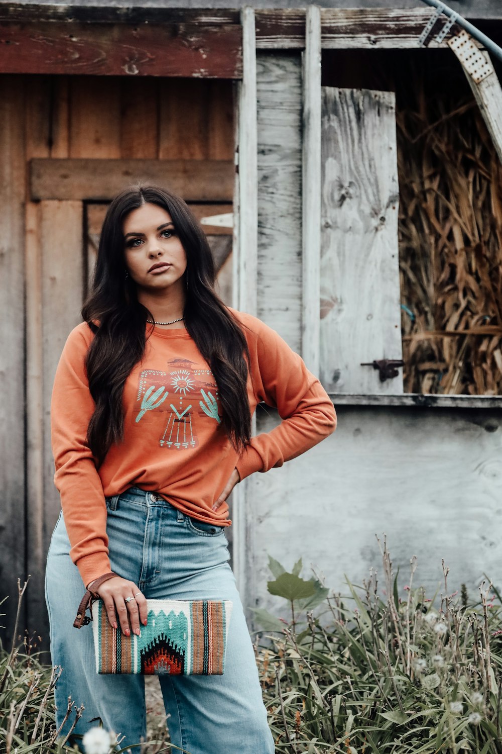 a woman standing in front of an old building