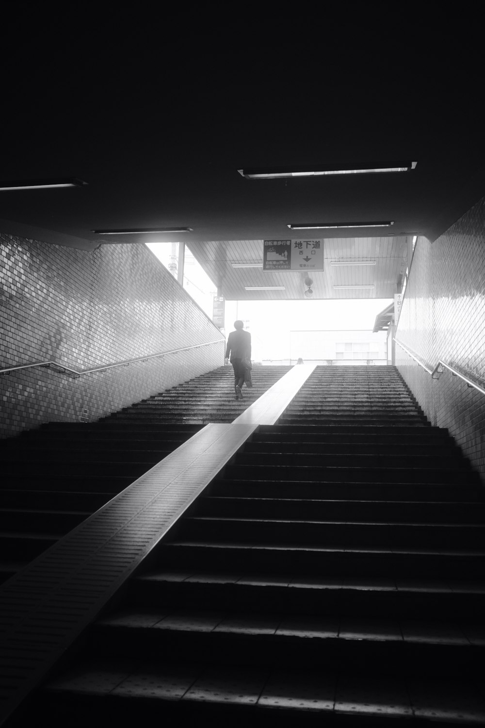a man walking up a flight of stairs