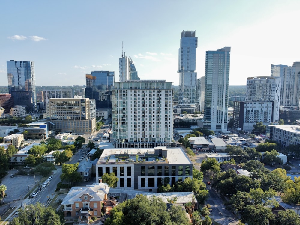 an aerial view of a city with tall buildings