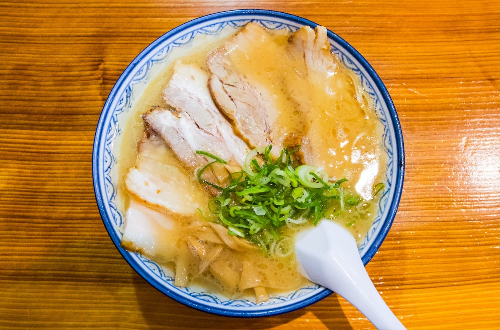 a bowl of soup with meat and vegetables