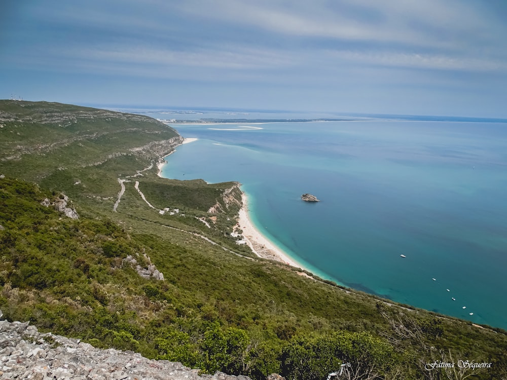 a view of the ocean from a hill