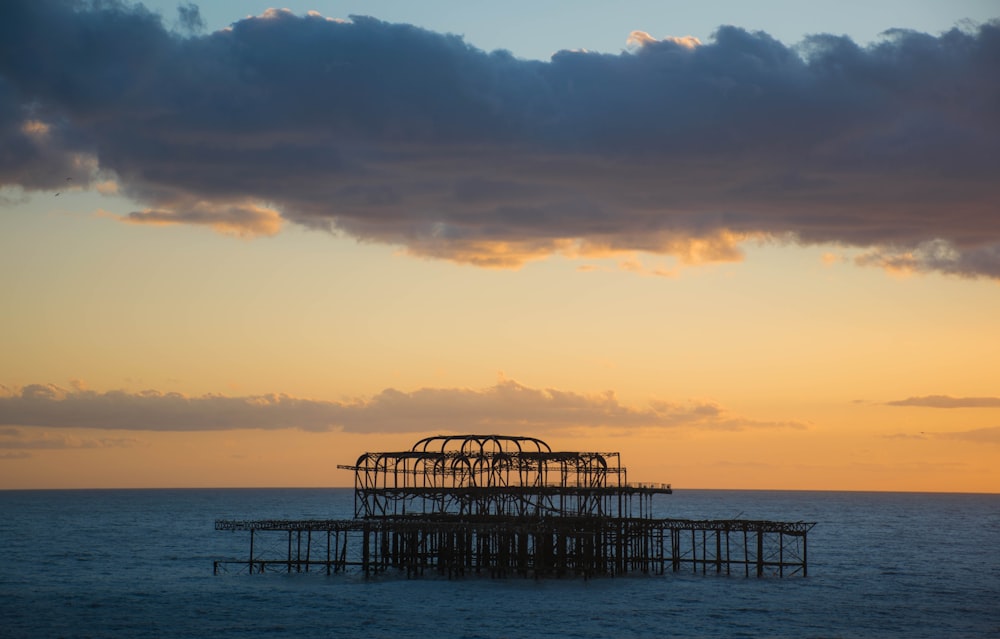 a structure sitting in the middle of the ocean