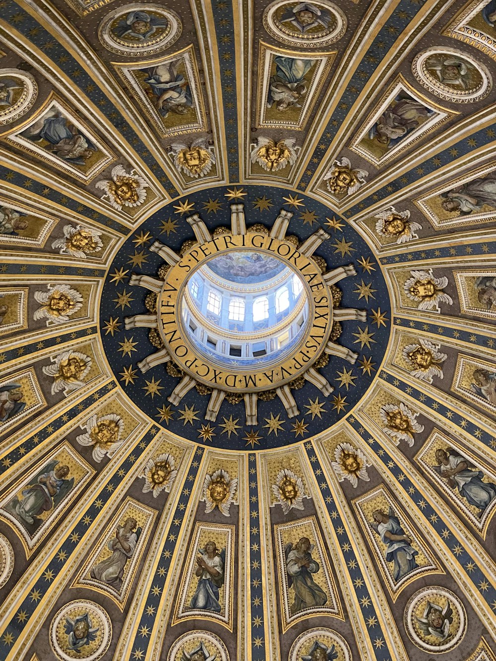 the ceiling of a building with paintings on it