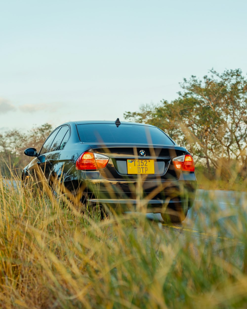 a black car parked on the side of the road