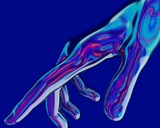 a blue and purple image of a person's hand