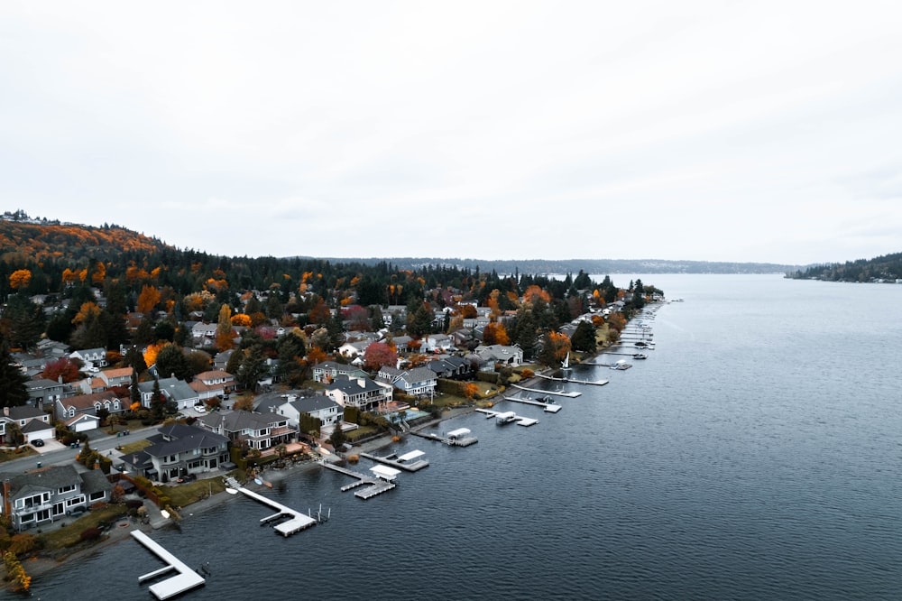 an aerial view of a small town on a lake