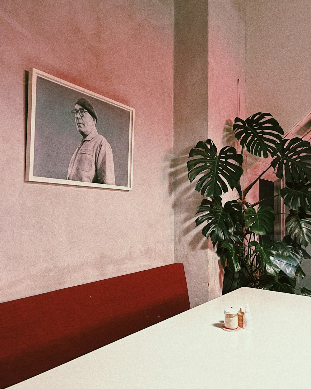 a picture of a man on the wall above a table