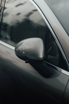 a side view mirror on the side of a car