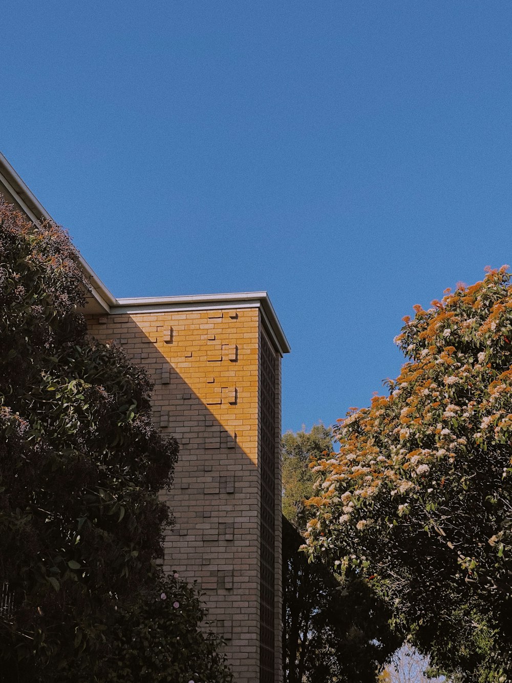 a clock on the side of a brick building