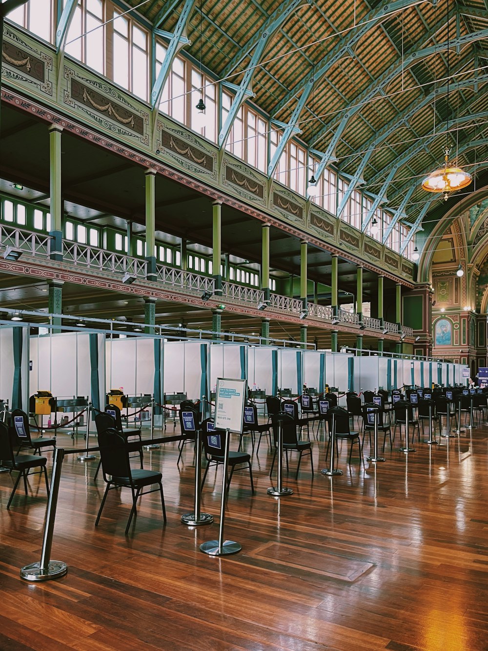 a long row of chairs in a large room