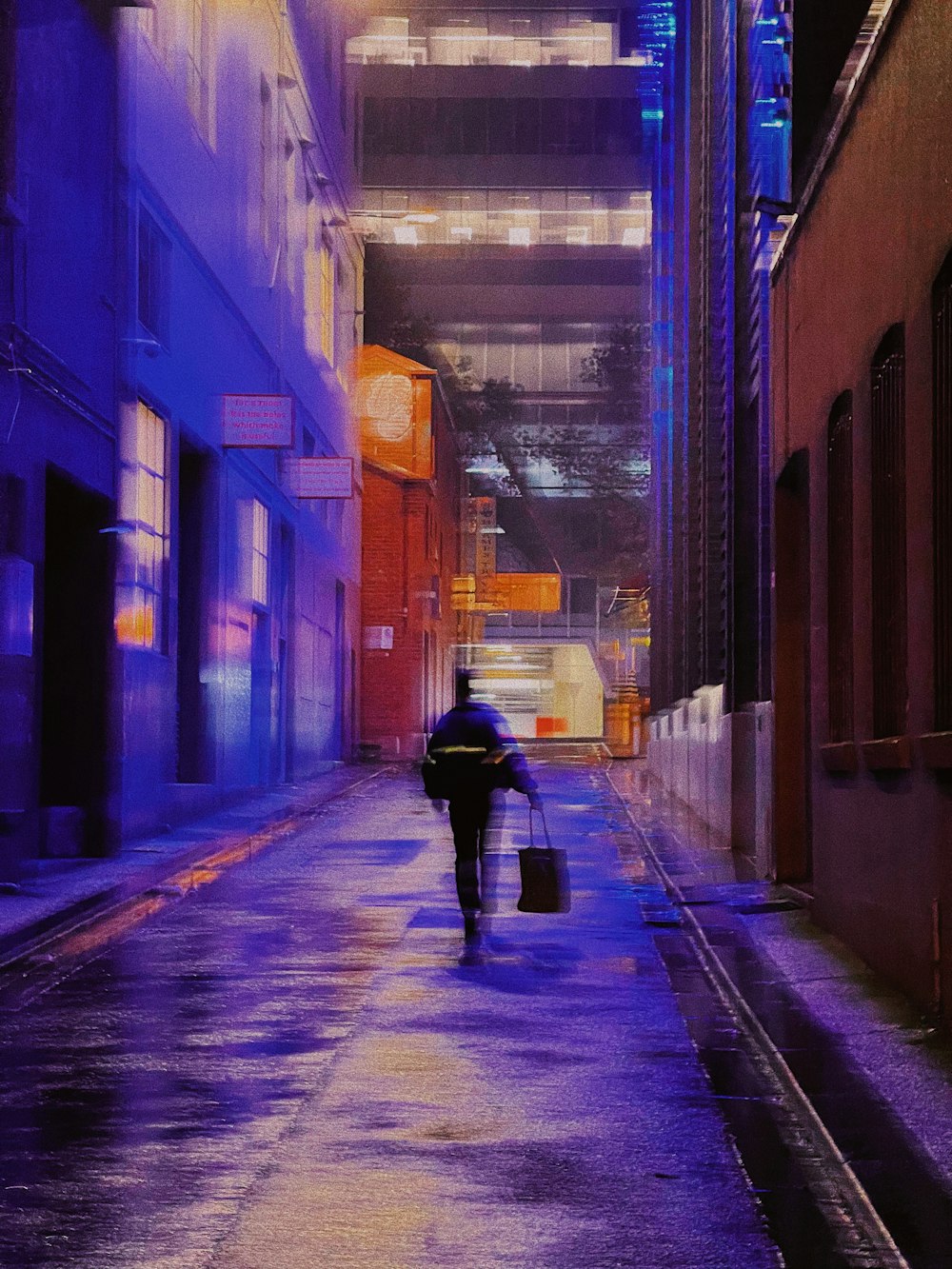 a person walking down a street holding an umbrella