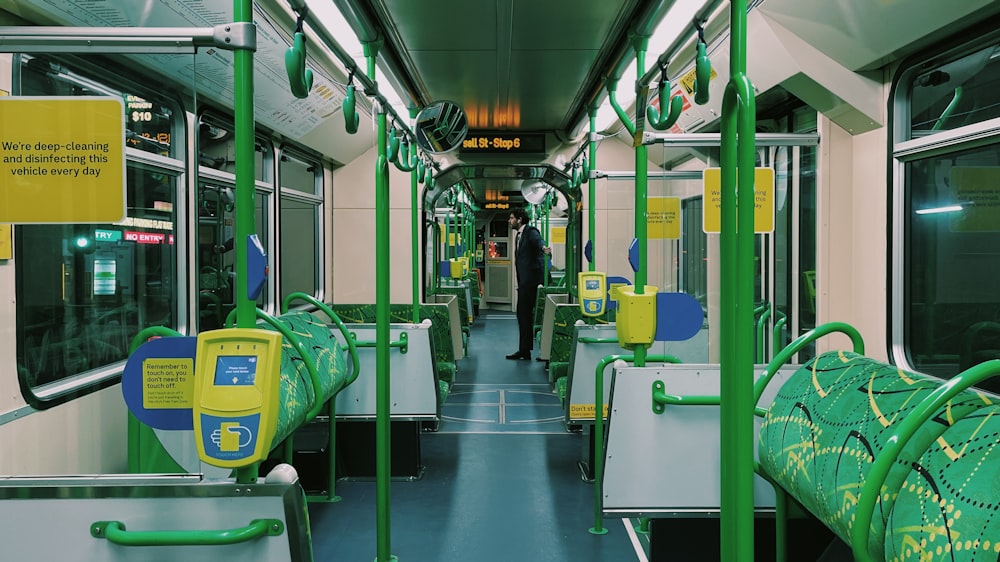 a man is standing on a subway train