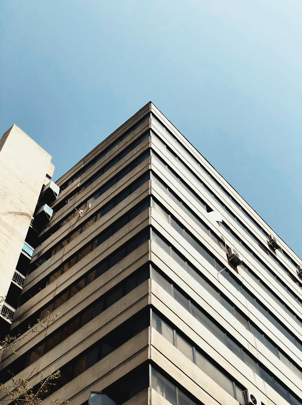 a very tall building sitting next to a tall building