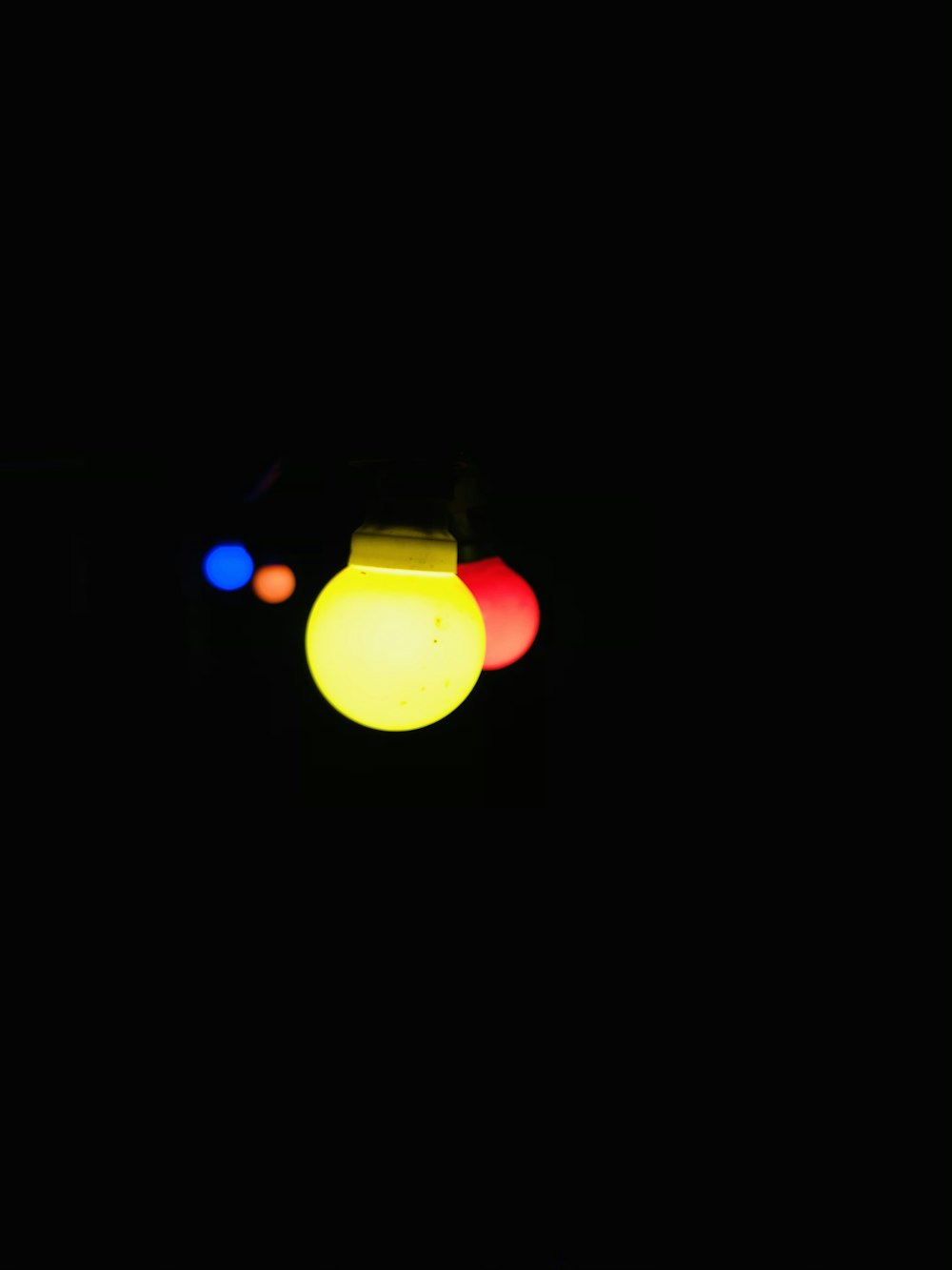 a close up of a traffic light in the dark
