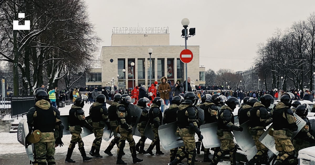 A large group of people in riot gear photo – Free Human Image on Unsplash