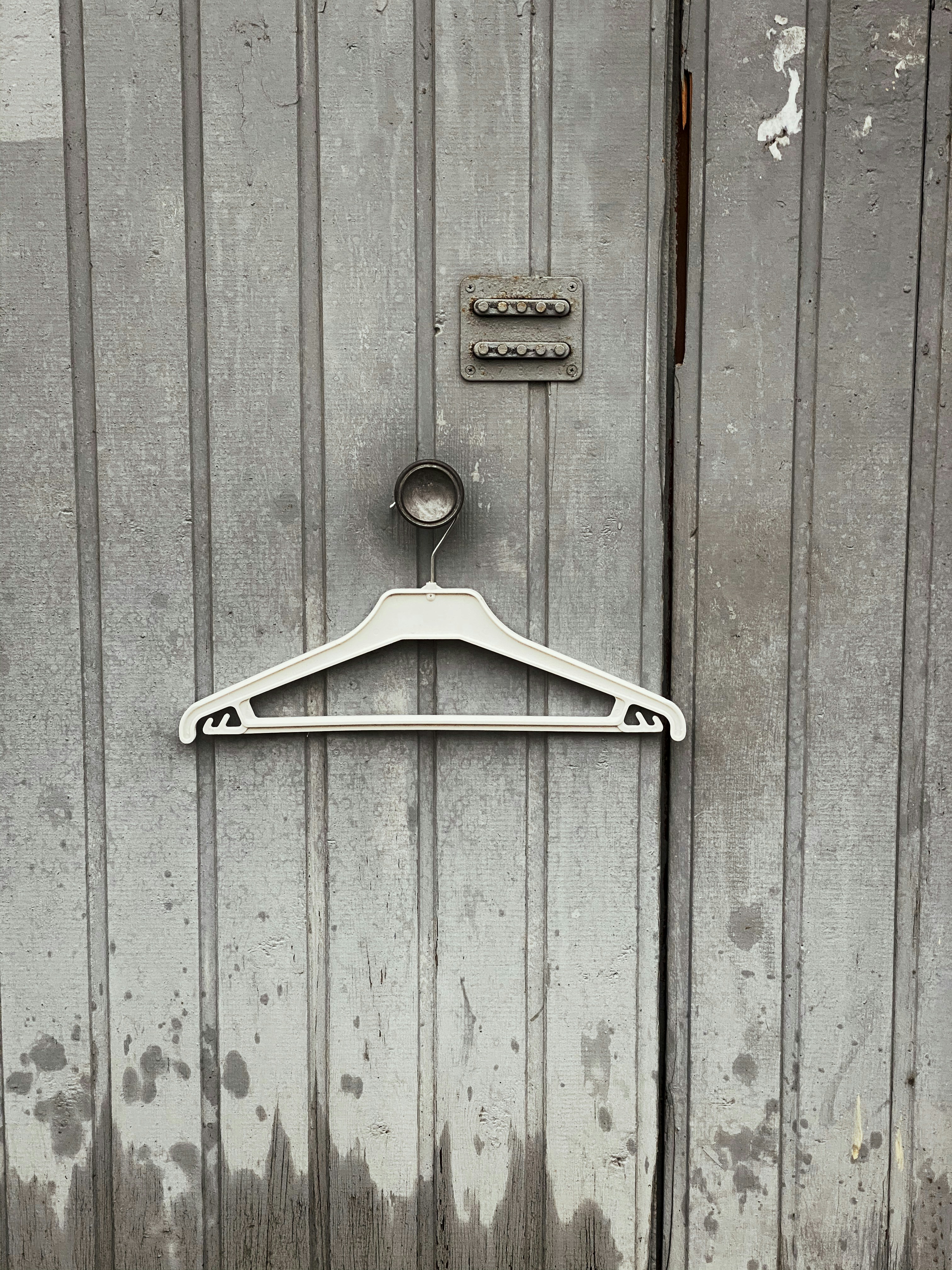 a coat hanger on the door of a building
