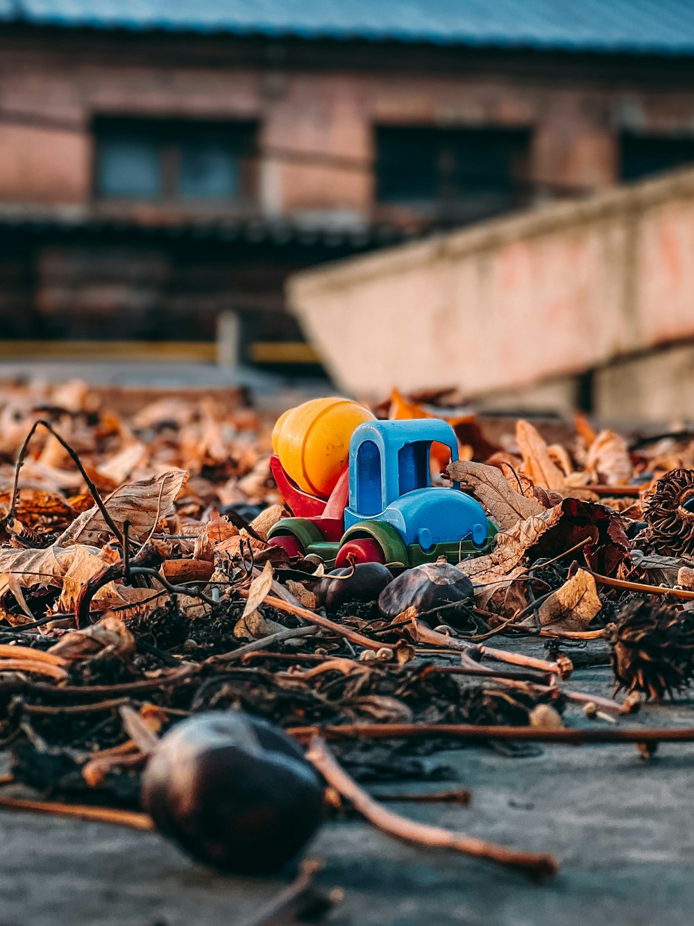 a pile of leaves and toys on the ground