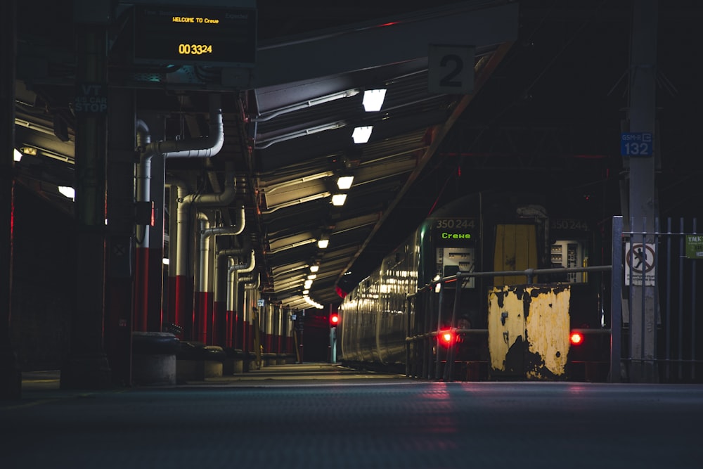 a train traveling down train tracks at night