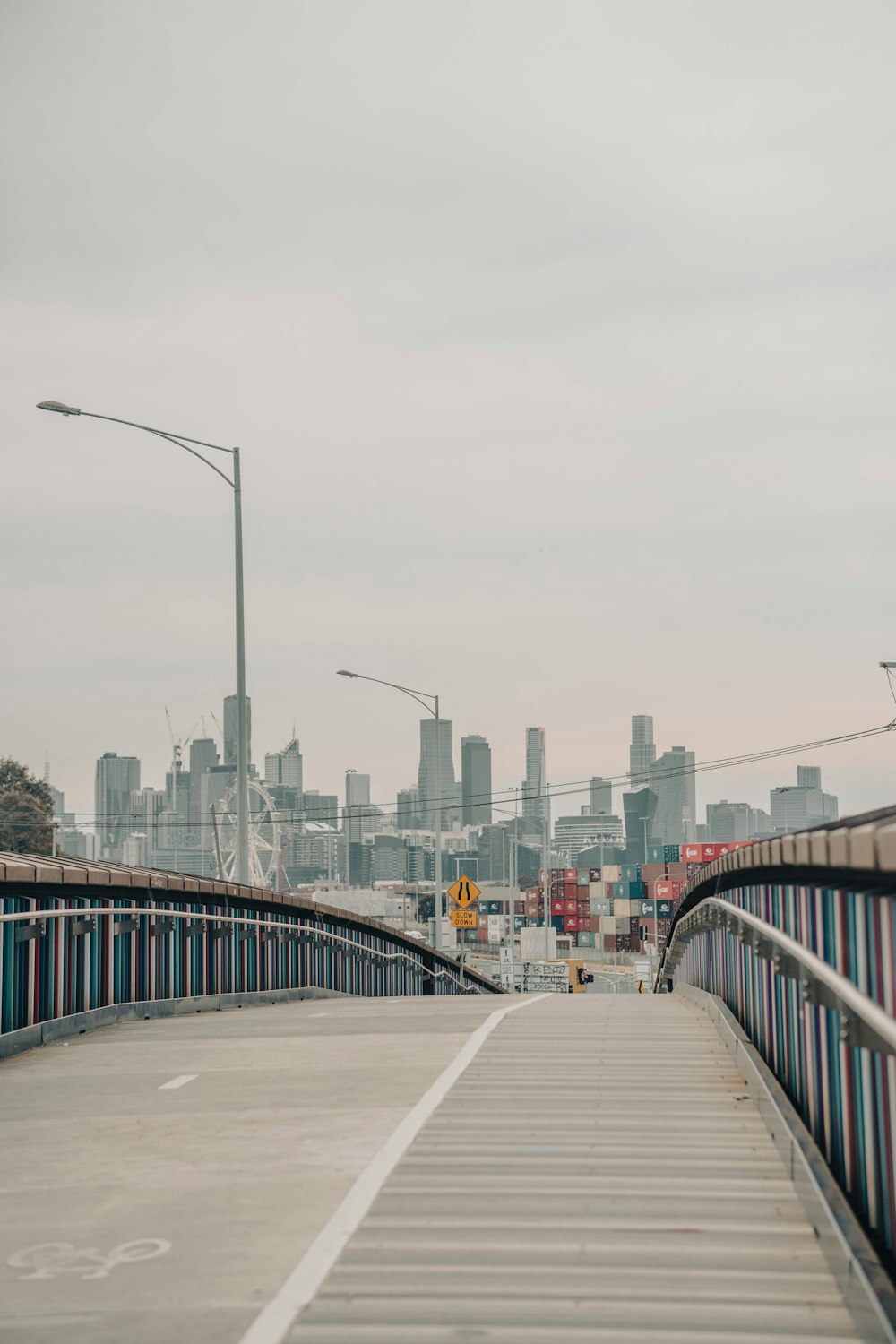 a bridge with a city in the background