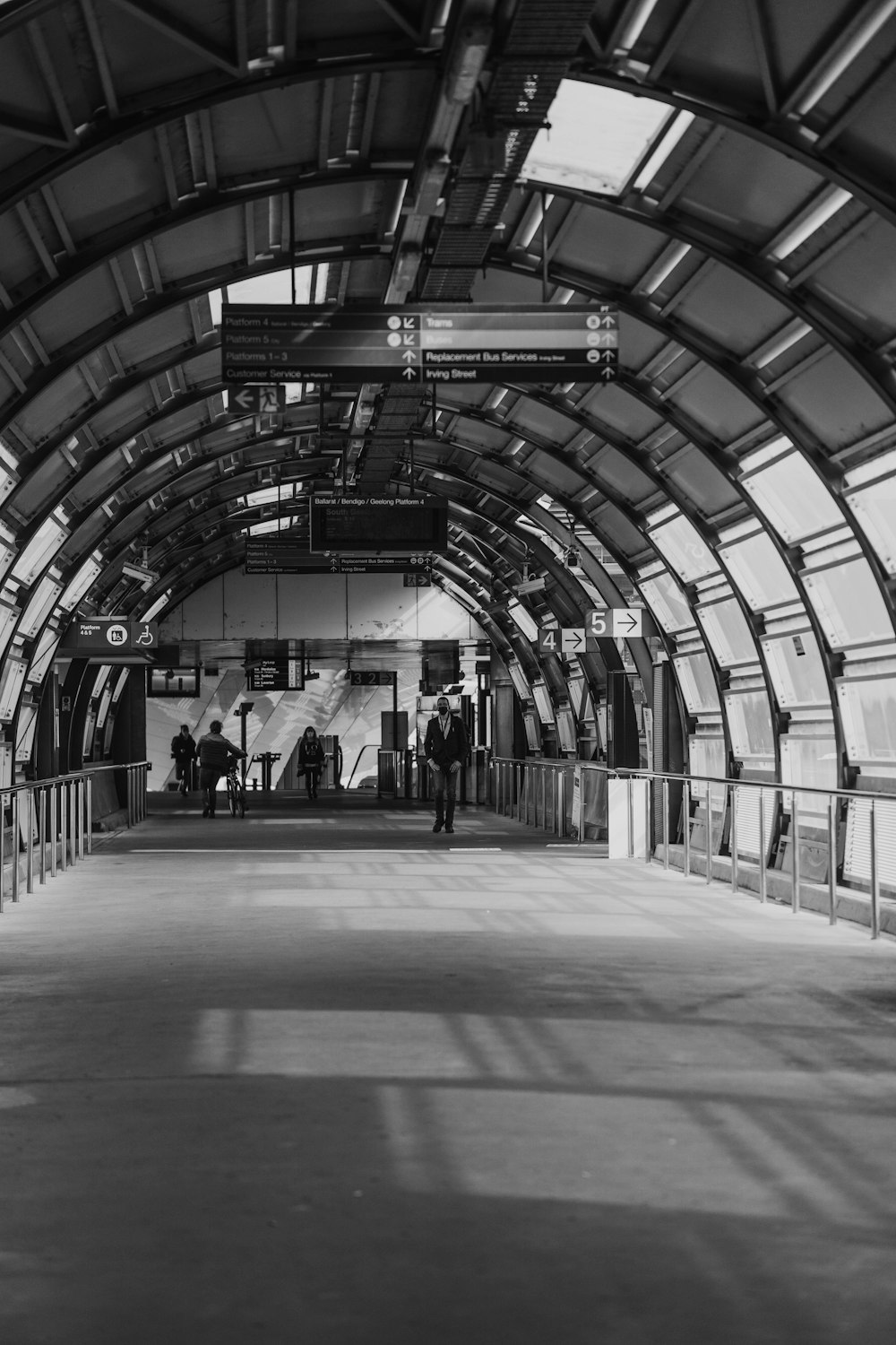 a black and white photo of a train station