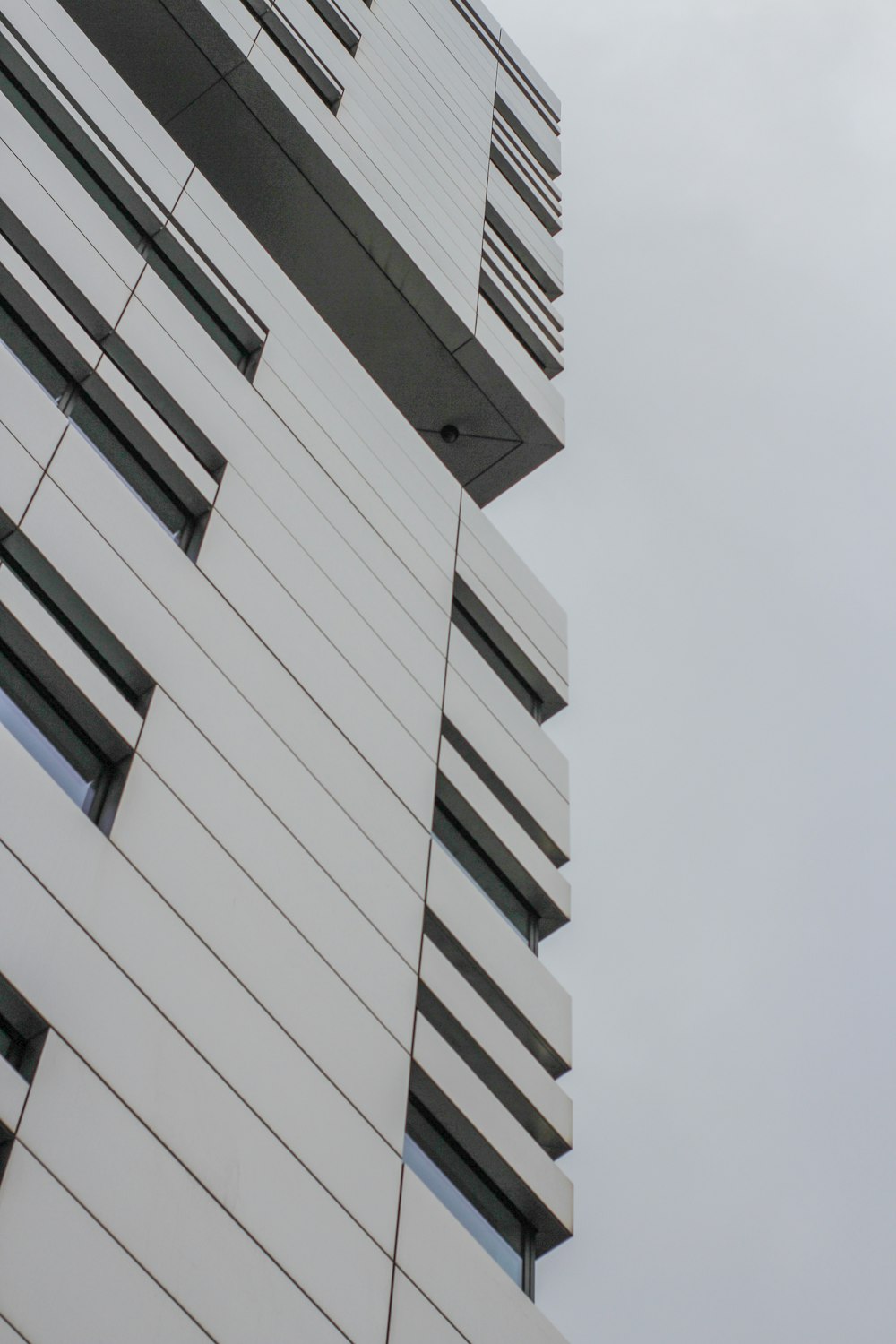 a tall building with a clock on the side of it