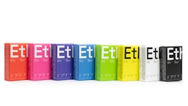 A row of colorful boxes is aligned, each with the large text 'Et' printed on them. The boxes vary in color, including shades of orange, pink, purple, blue, green, yellow, white, and black. Each box appears to have text and measurements along the side.