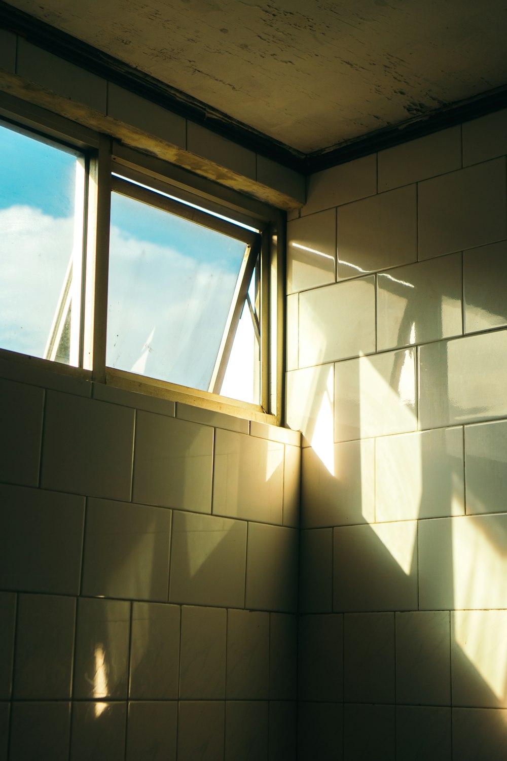 a shadow of a person standing in front of a window