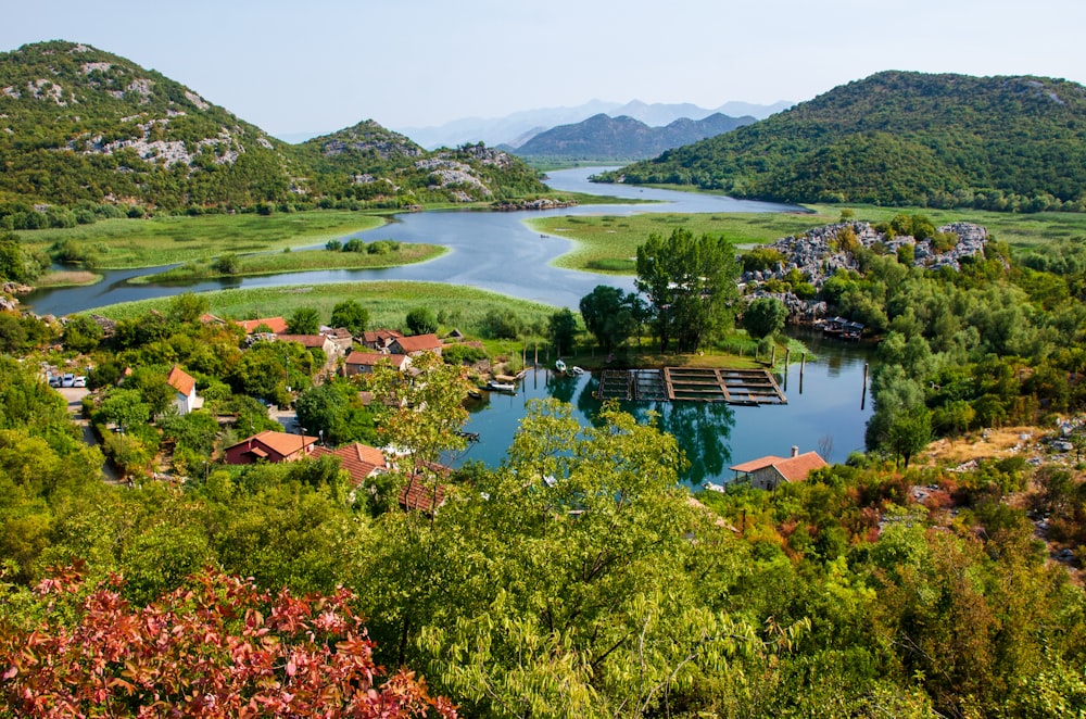 a river running through a lush green countryside