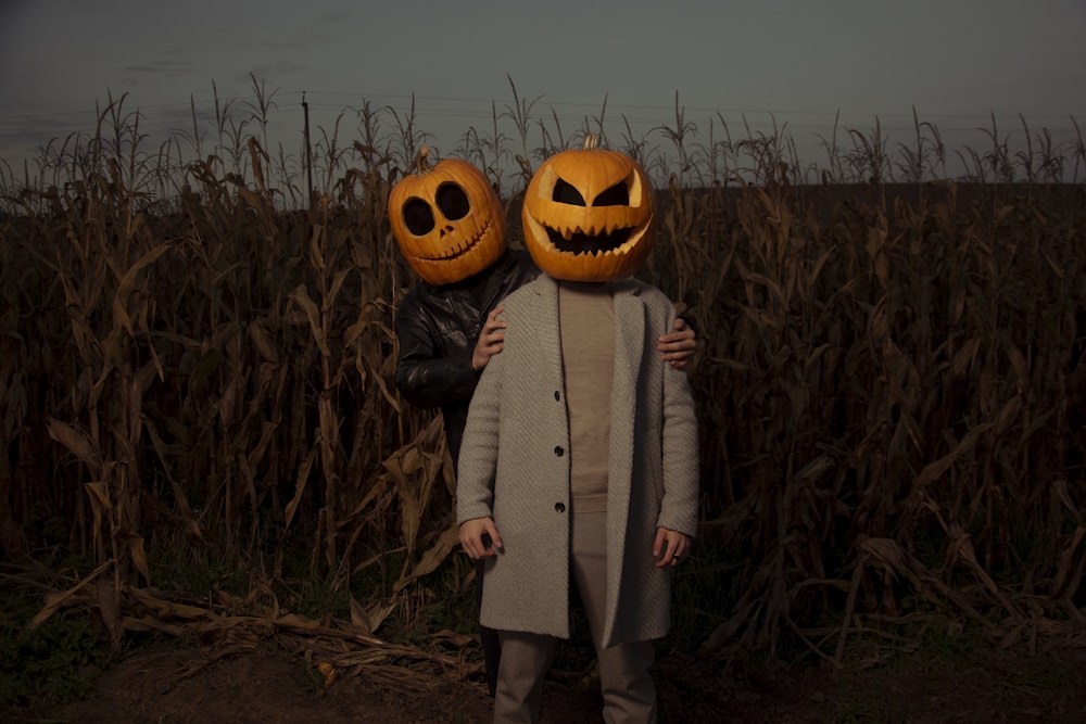 a couple of people that are standing in a field