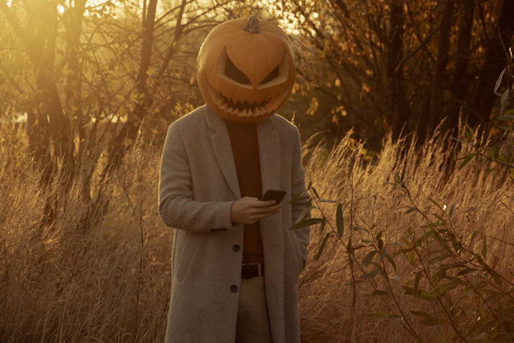 a person wearing a jack o lantern pumpkin mask