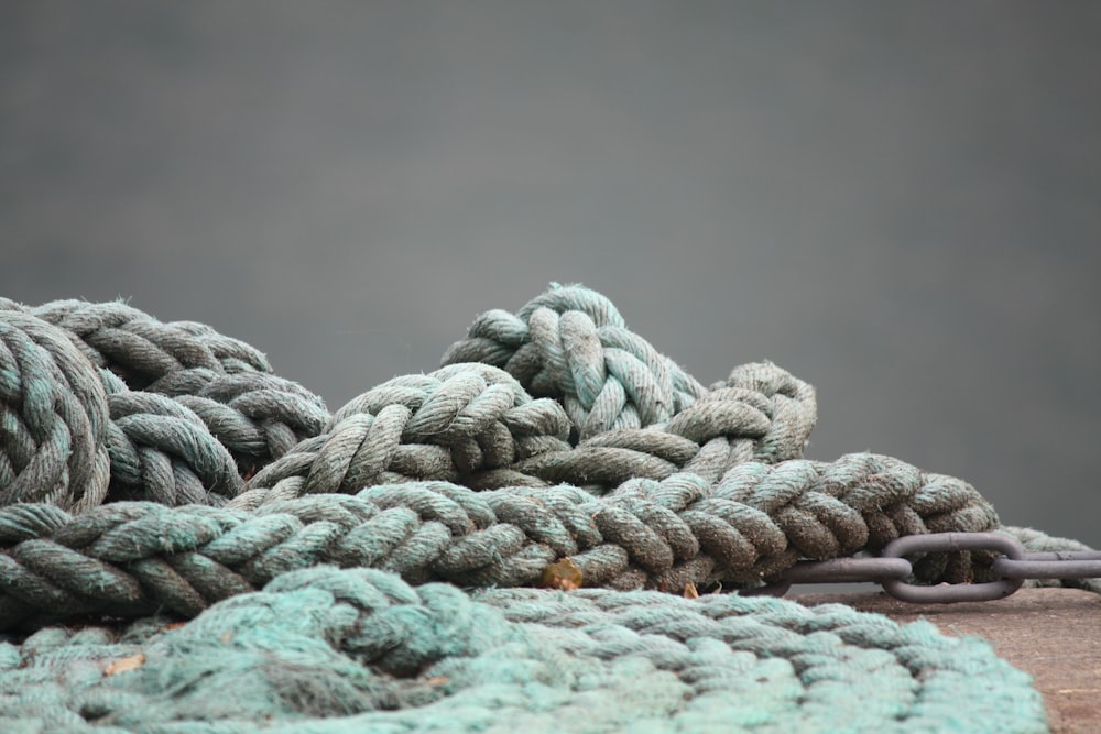 a pile of rope sitting on top of a wooden table
